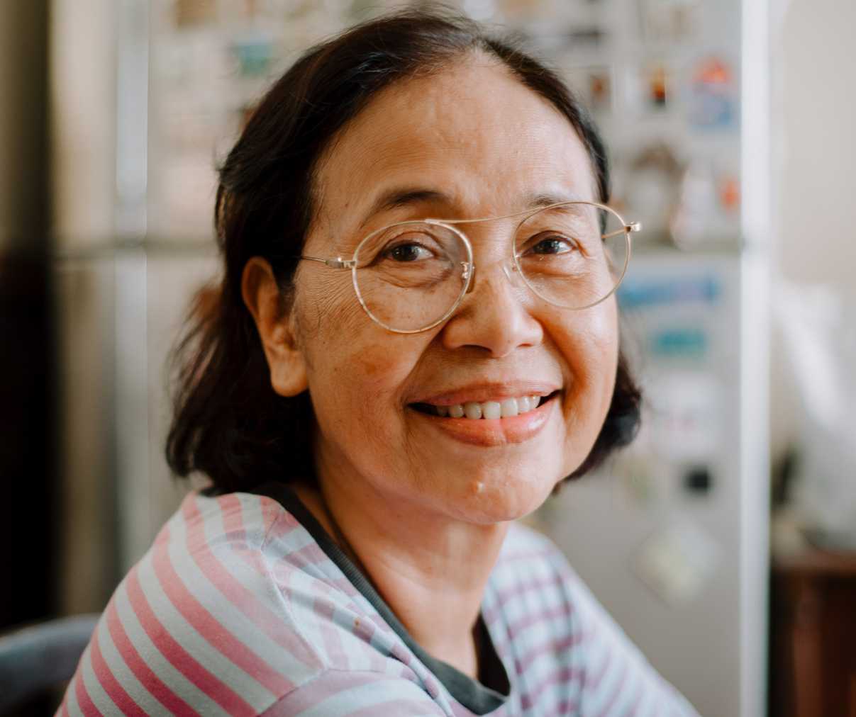 An elderly woman smiling